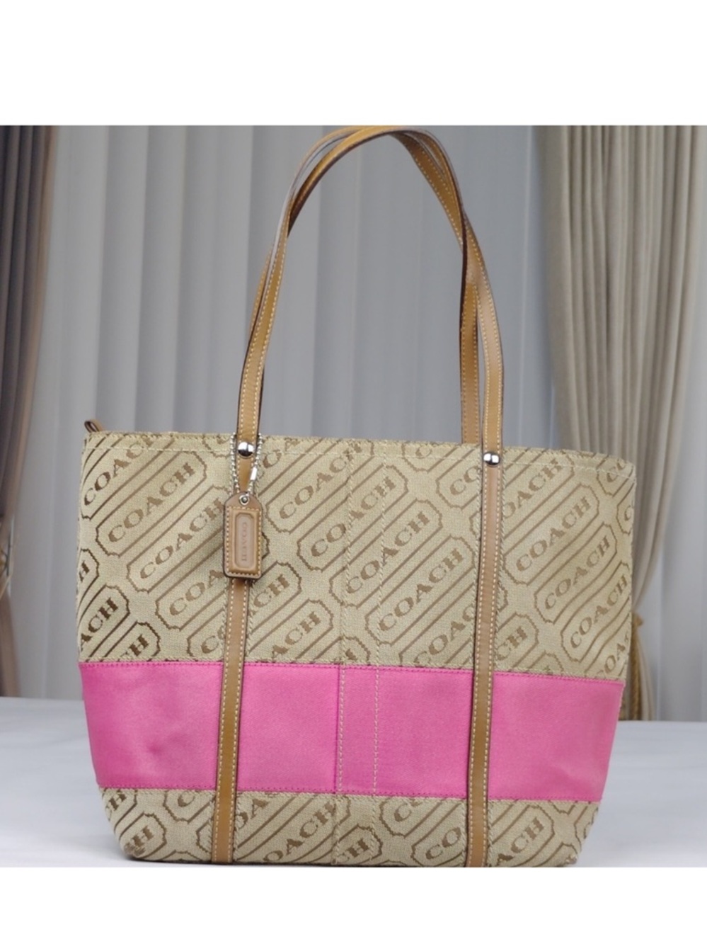 Coach Signature Logo Canvas Tote
Handbag.